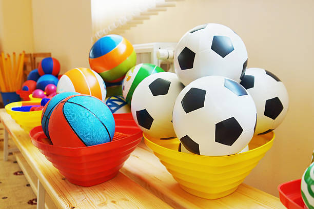 A young girl plays soccer, radiating beauty, happiness, and healthy activity.