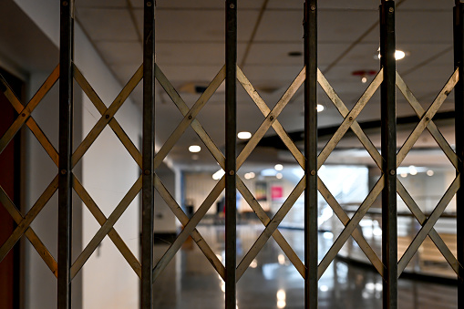 Scissor gate pulled across a hallway to close off a section of building