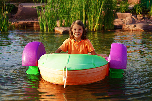 boy in a boat stock photo