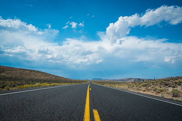 istock Blue sky and clouds above desert highway 185853077