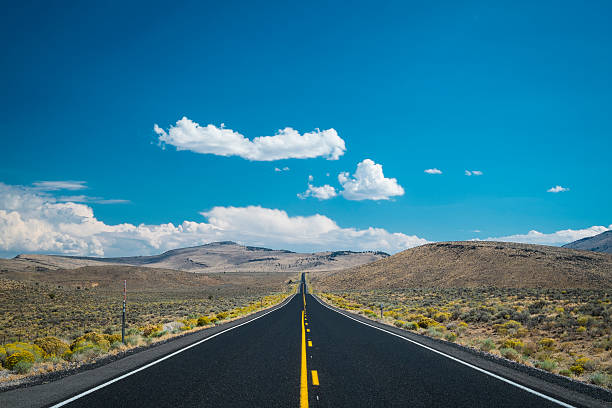 istock Blue sky and clouds above desert highway 185853078