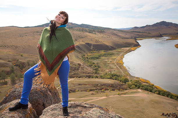 istock woman on a rock in the mountains 185853669