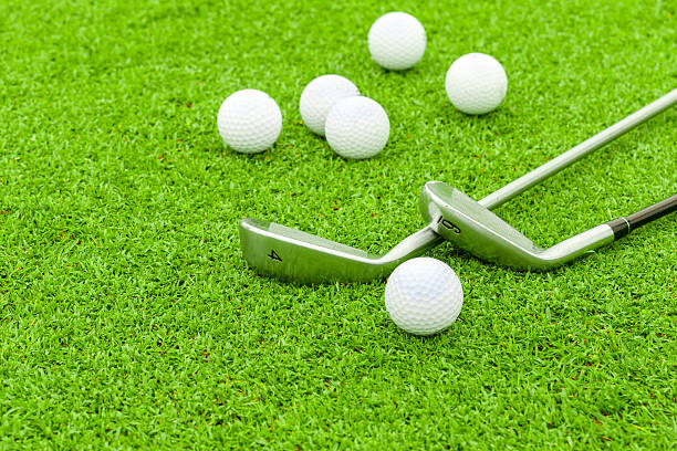 istock golf ball on tee in front of driver green course 185853954