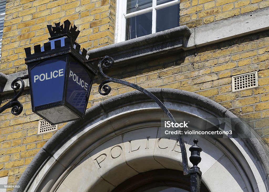 London - Police Sign A Police sign above the doorway to a police station in London, United Kingdom Police Station Stock Photo