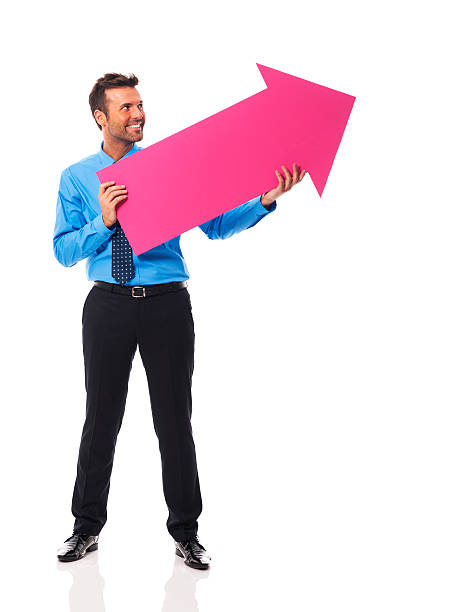 istock Handsome business man holding pink arrow 185855064