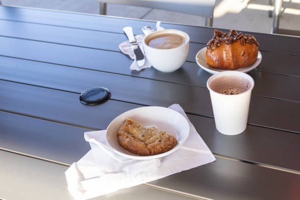 Cookie and Hot Chocolate on an outdoor dining table