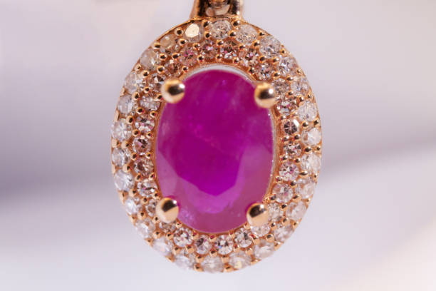 istock Earring with pink stone on gold frame 1858576288