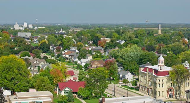 Leftward Orbiting Shot of Small Town in Wisconsin on Clear Day - Aerial