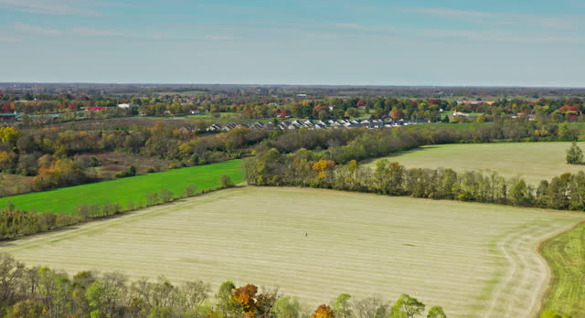 Drone Flight Over Farmland Towards Housing Development in Georgetown, Scott County, Kentucky