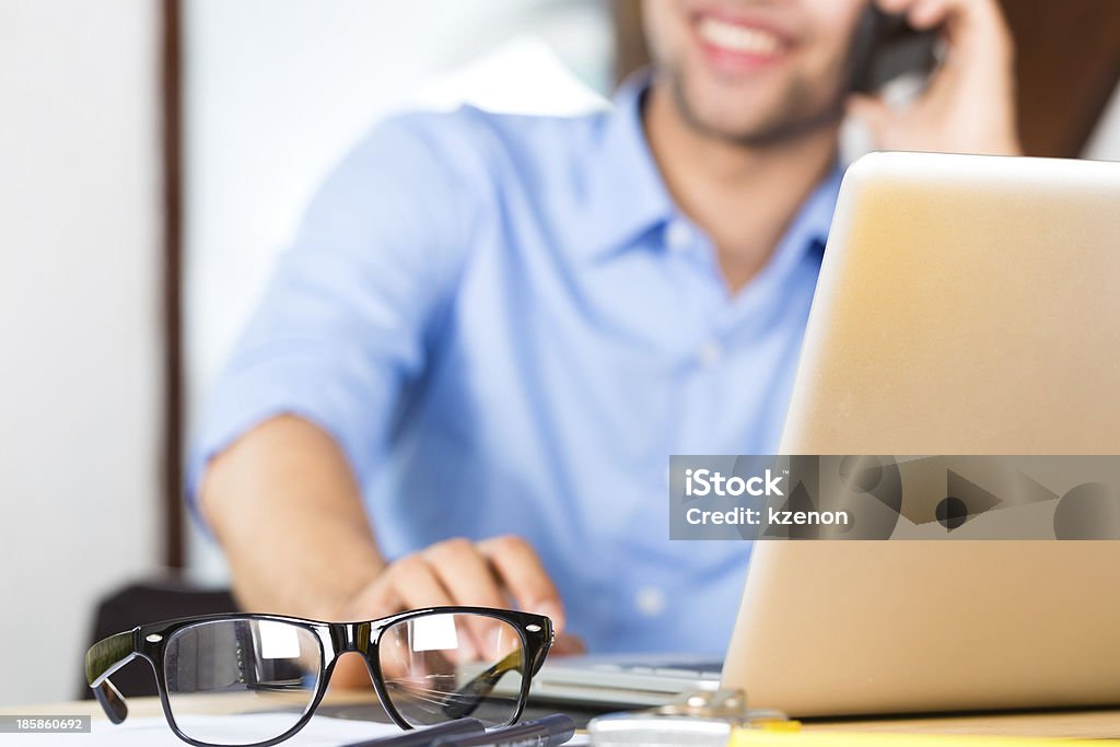 Architect working at home Freelancer - Architect working at home talk with a client on the phone Adult Stock Photo