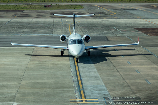 private business jet parked at the airport, with copyspace