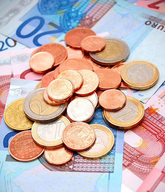 istock Coins for euro banknotes. 185866641
