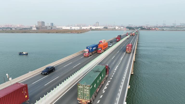 Transport trucks crossing the bridge