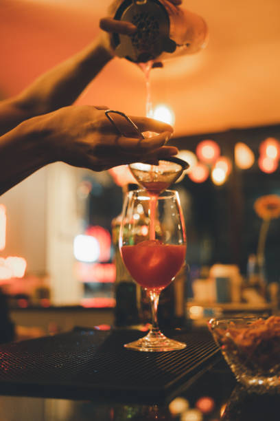 istock Barman is making cocktail at night club. 1858677633
