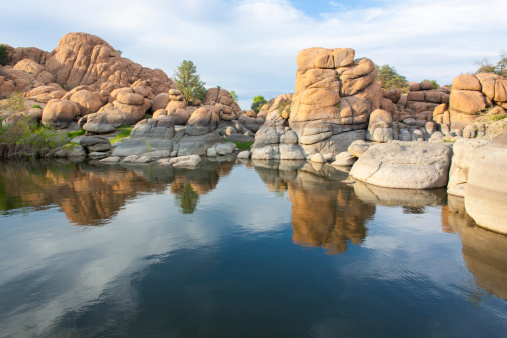 granite rock formations reflected in watson lake prescott arizona