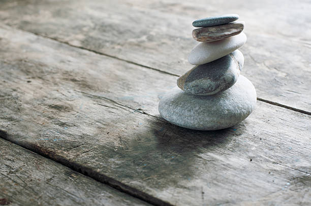 istock zen rocks on old wooden plank 185870599