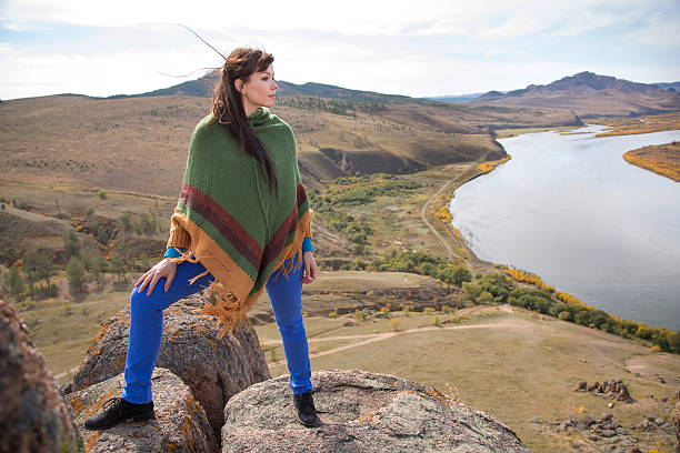 istock woman on a rock in the mountains 185876913