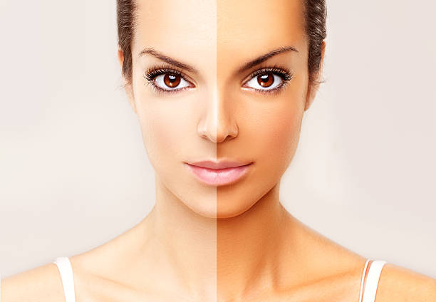 istock Model's face divided in two parts - tanned and natural. 185877088