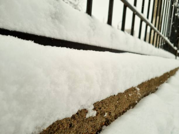 istock Street fence covered with snow 1858784258