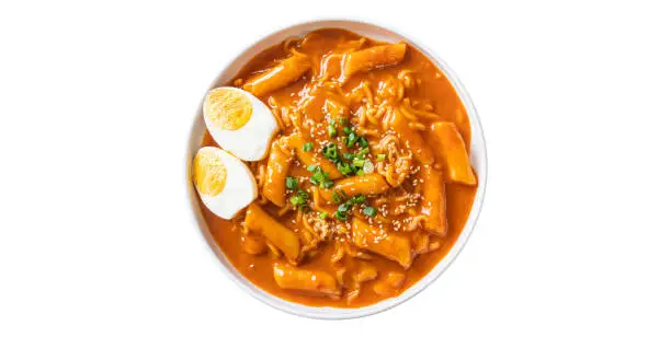 Photo of Spicy Cheesy Tteokbokki Fusion Asian food dishes in a bowl placed on a white background