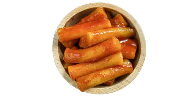 Photo of Spicy Cheesy Tteokbokki Fusion Asian food dishes in a bowl placed on a white background