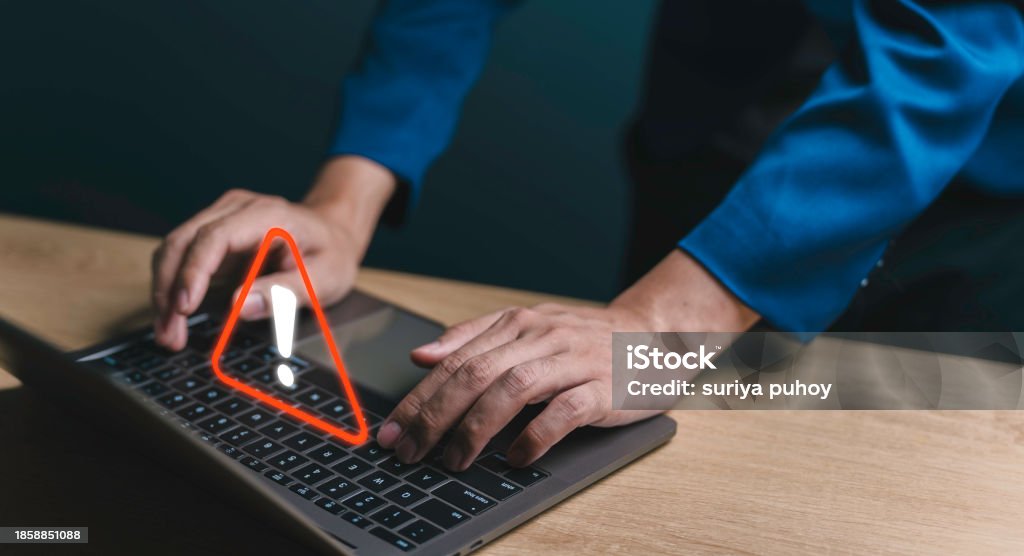 Using Computer Warning Sign Businessman Using Computer Laptop With Triangle Caution Warning Sign ...