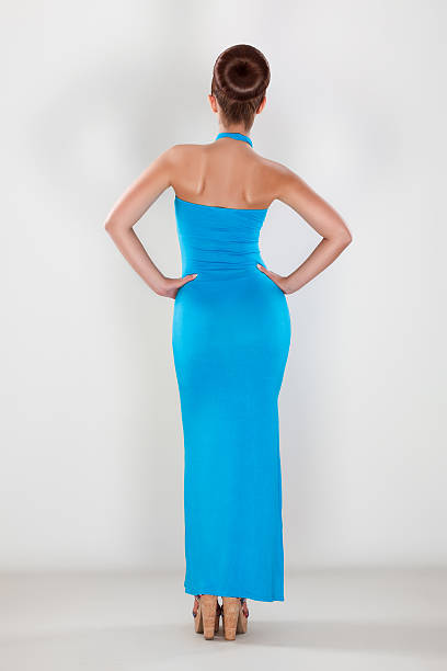 istock Young beautiful female posing with her back to the camera 185885264
