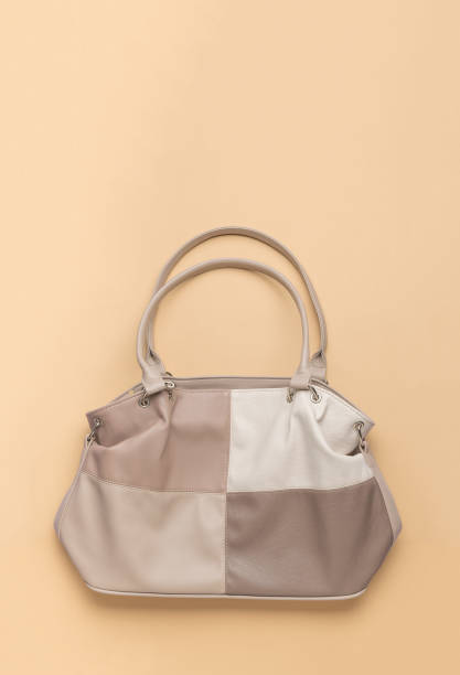 istock Four-color leather bag on a light background. A place for your text. 1858854744