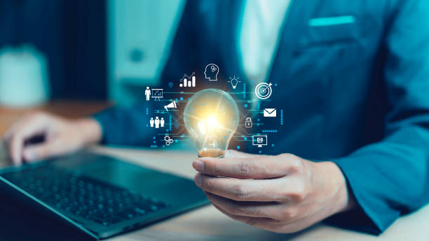 istock businessman Hand holding Light bulb Global connection. Business global and technology digital marketing, Financial idea innovation business development inspiration intelligence and target 1858856828