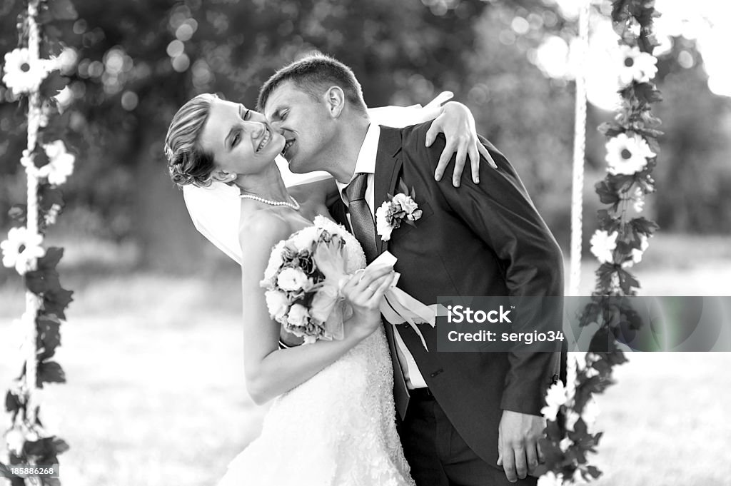 Groom and  bride Groom and  bride on green glade Adult Stock Photo