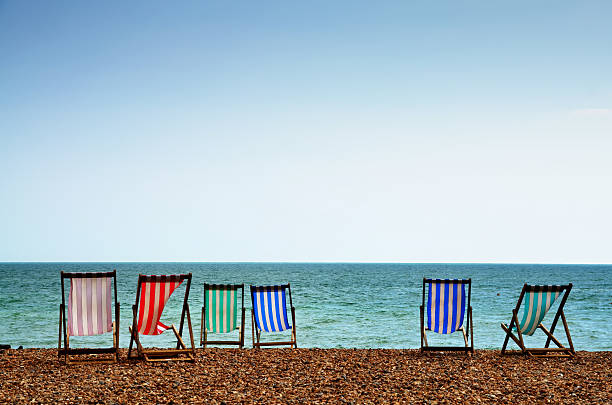 Deckchairs on Brighton Beach stock photo