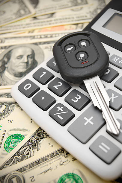 istock Keys from the car and calculator on money. 185890279