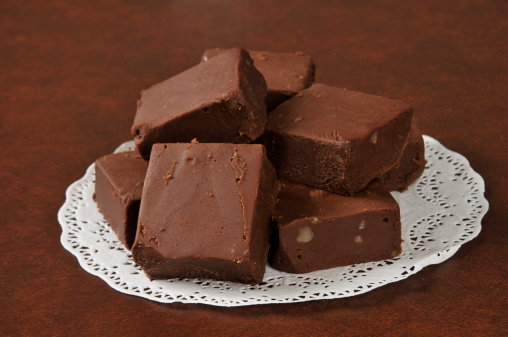 Gourmet sliced fudge on a doilie with nuts