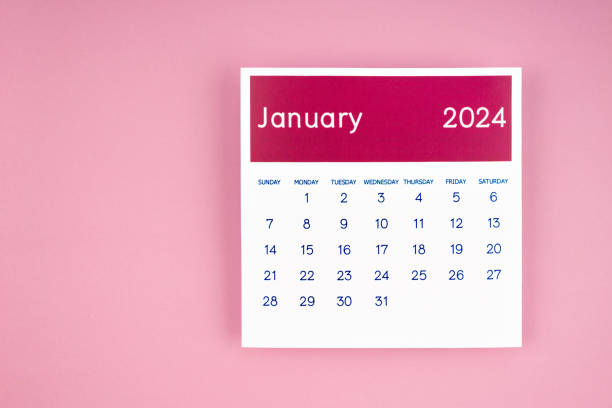 istock calendar page January 2024 on pink background. 1858916373