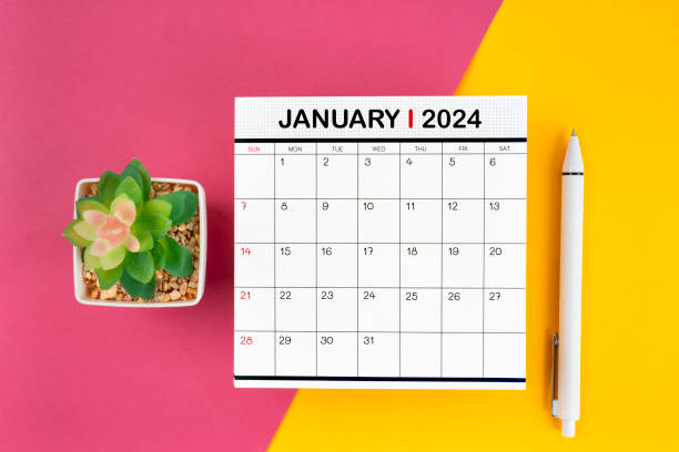 istock White calendar for January 2024 and pen on beautiful background. 1858916376