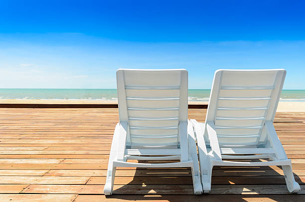 istock white chair near the beach 185891761