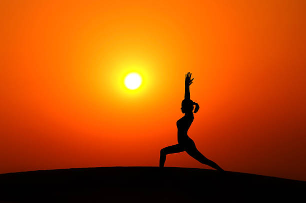 istock Silhouette woman doing yoga 185891815