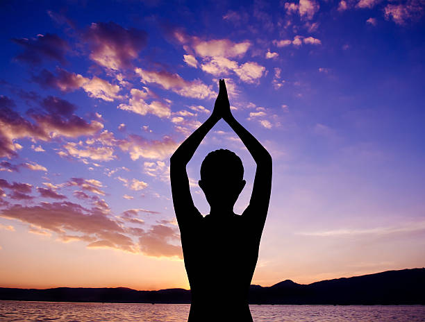 istock Silhouette yoga prayer pose 185891825
