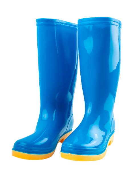 istock Pair of blue and yellow rubber boots isolated on white background. 1858918446