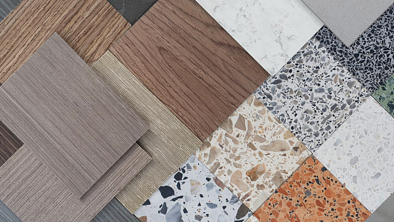 creative palette composition of interior material samples. mood board contains multi texture and color of terrazzo stones and wooden veneer for build in furniture and interior surface finishing.