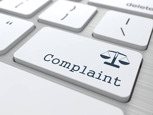 Complaint button on a white keyboard stock photo