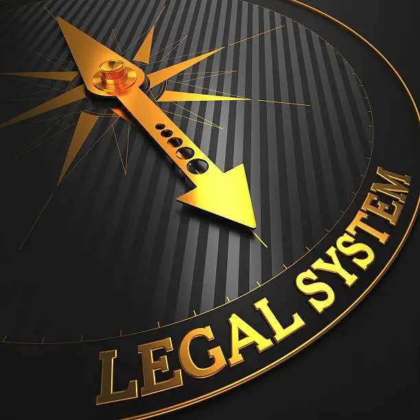 Legal System - Business Background. Golden Compass Needle on a Black Field Pointing to the Word "Legal System". 3D Render.