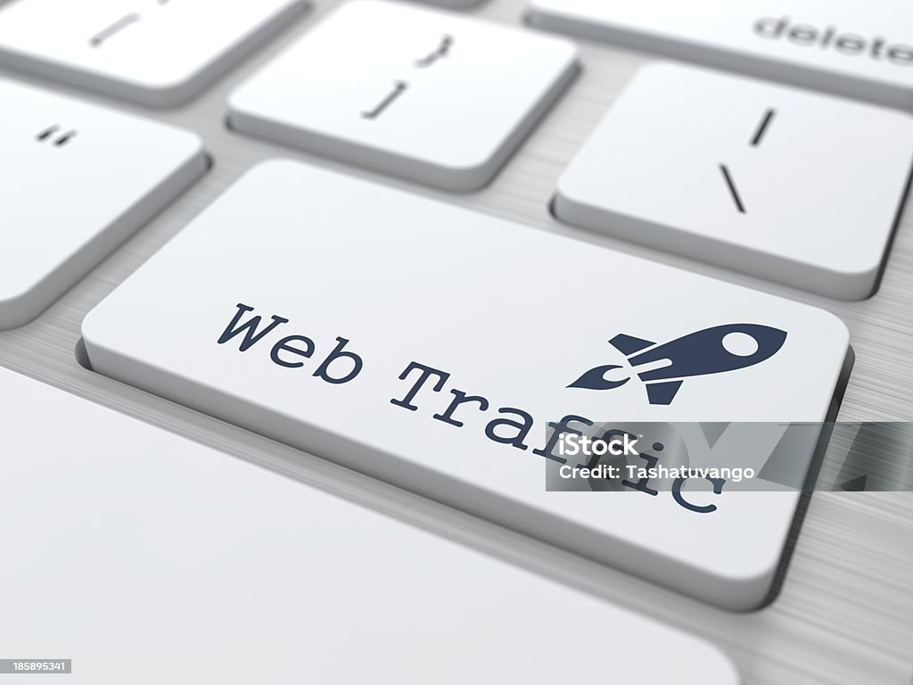 Web traffic keyboard button with rocket White Button with Web Traffic on Computer Keyboard. Internet Concept. Traffic Stock Photo