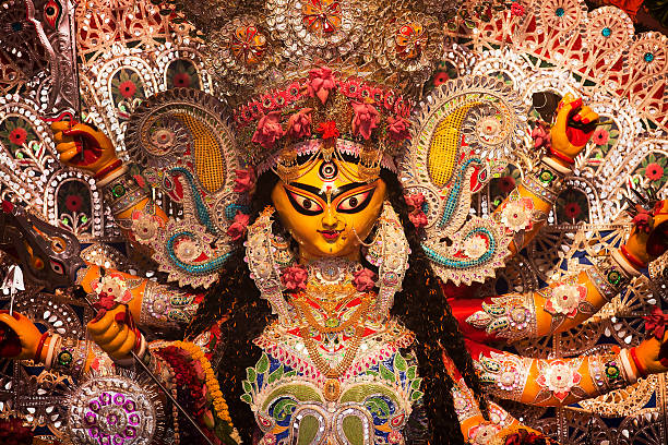 Indian Deity : Goddess during Durga Puja Celebrations. An Indian Deity : Goddess Durga. Durga worship is a yearly event and these deities are created every year and immersed in a river every year after the completion of the 5-day event. bangladesh photos stock pictures, royalty-free photos & images