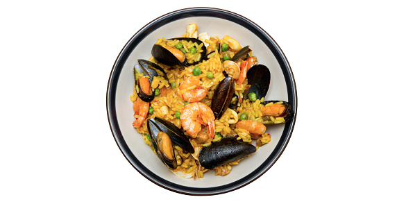 Paella, classic dish of Spanish gastronomy with seafood, meat, chicken and saffron rice