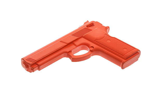 istock Dirty red training gun isolated on white 185899066