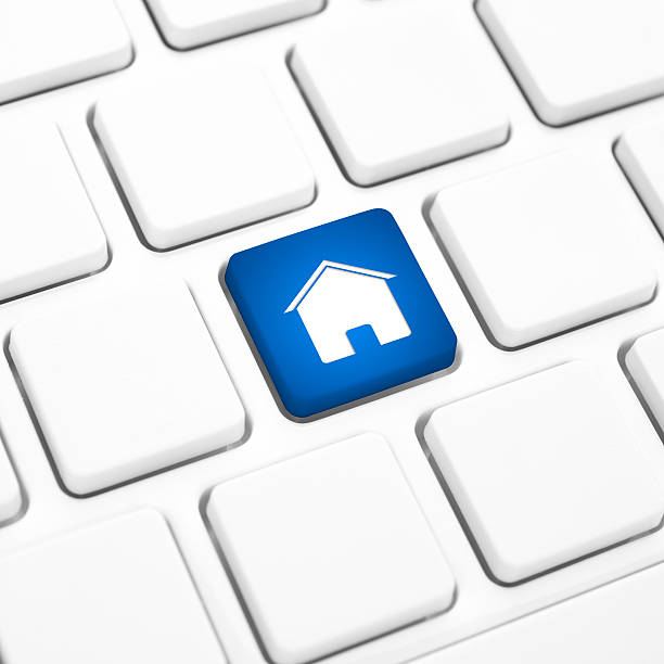 istock Home or real estate concept, blue house key on keyboard 185902936