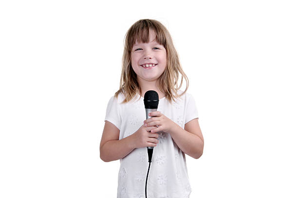 istock The girl sings with a microphone in hands 185903998