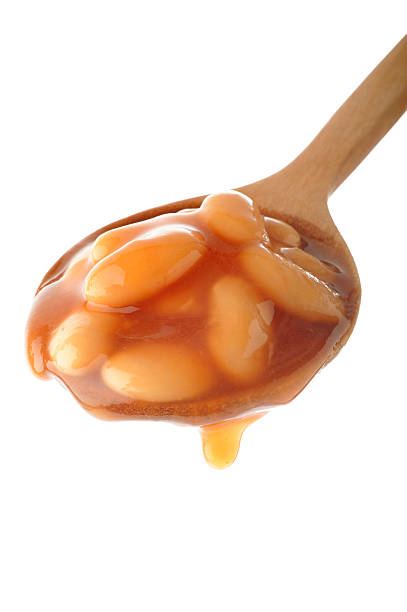 istock baked beans in wooden spoon 185904764