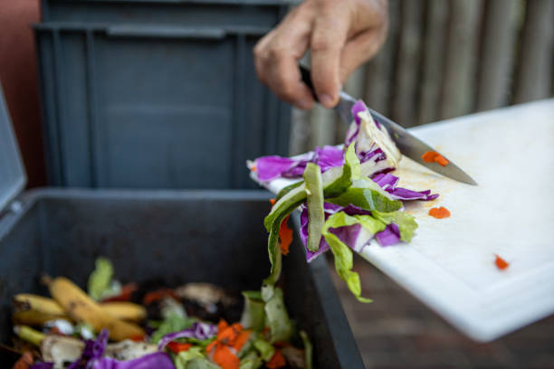 istock Man composting organic remains in home composter 1859051213